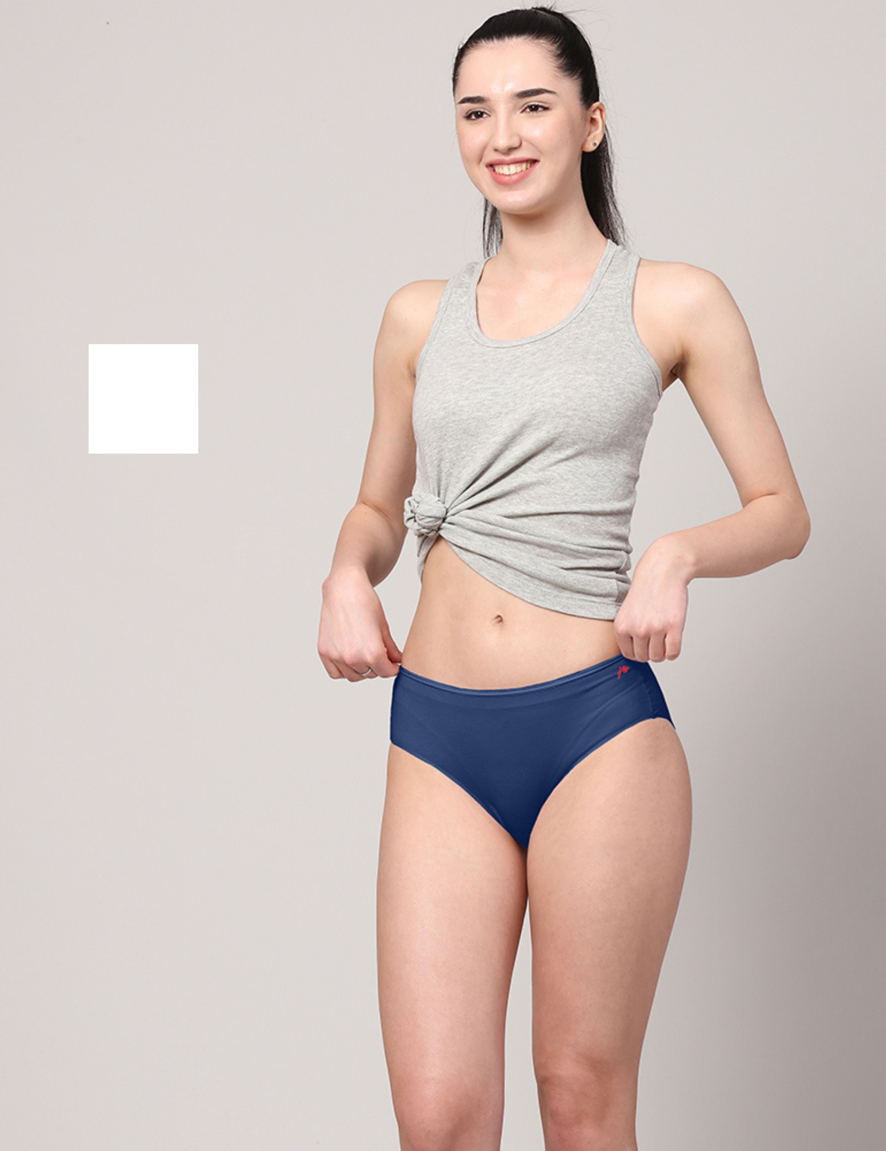 Against white colored background. Woman in underwear with slim