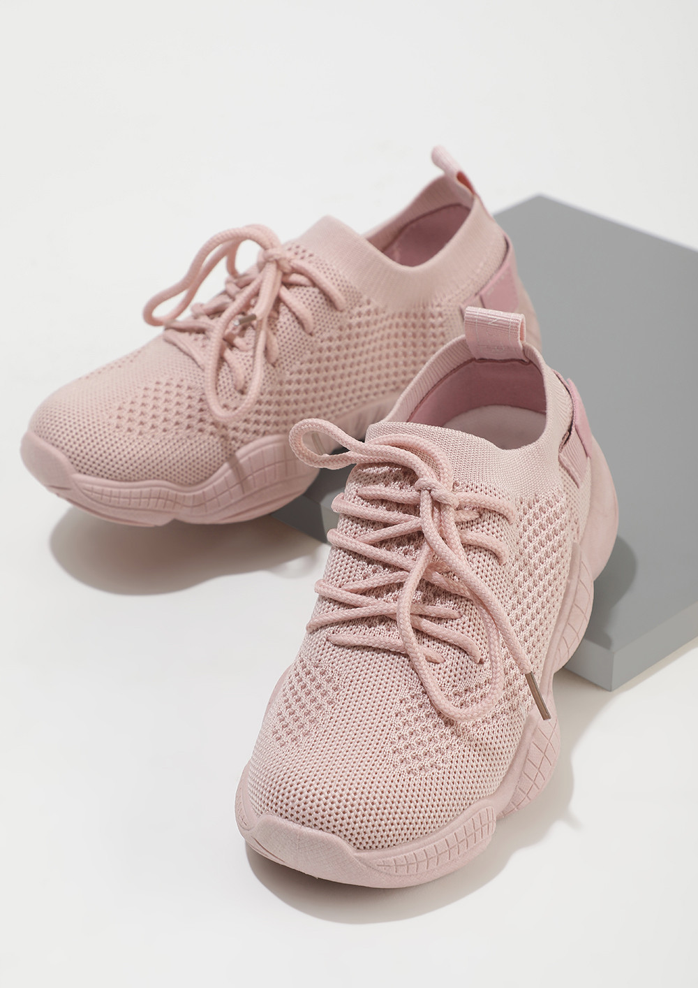 DAMAGE CONTROL IN PINK SOCK-COLLAR TRAINERS