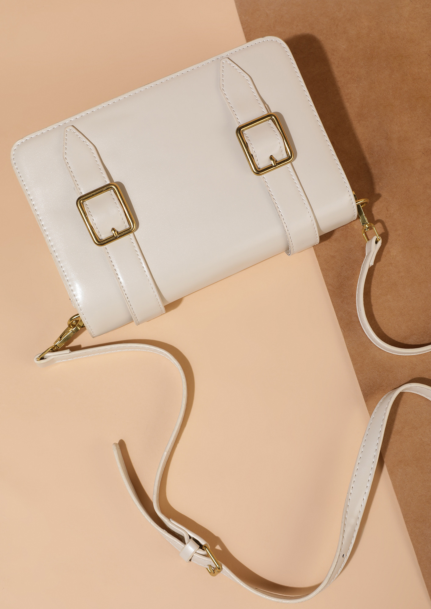 DOUBLE BUCKLED DOWN APRICOT WHITE SLING BAG