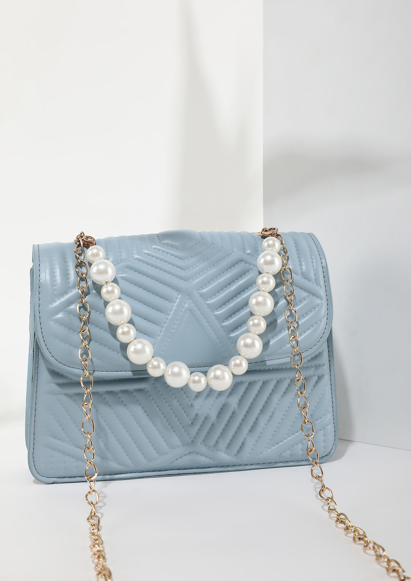 LOVE IS IN A SMALL SIZE BLUE SLING BAG