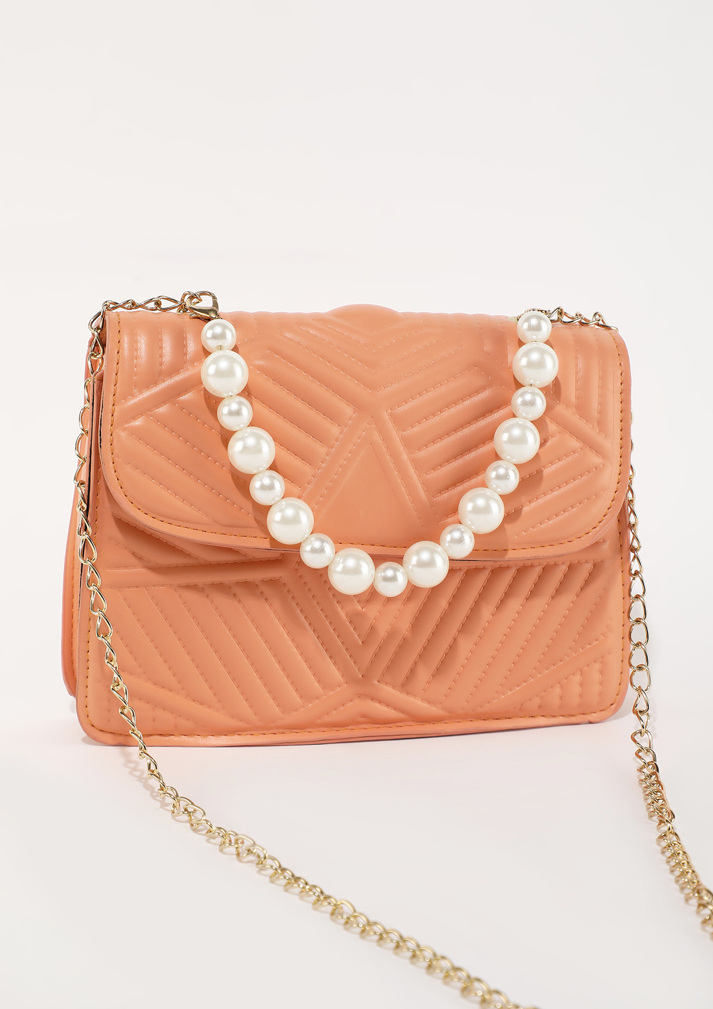 LOVE IS IN A SMALL SIZE ORANGE SLING BAG