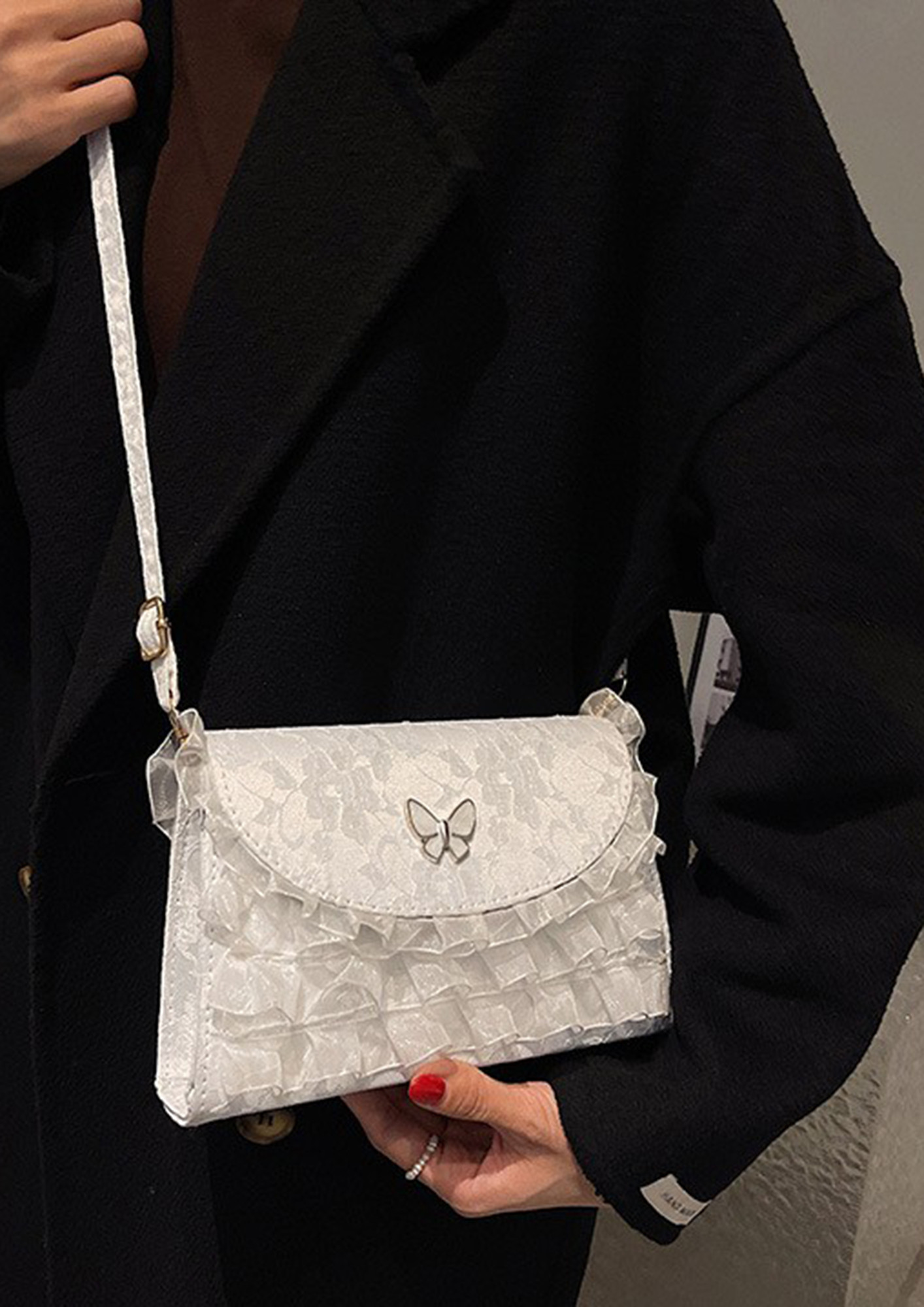 A LITTLE UPBEAT WHITE SLING BAG