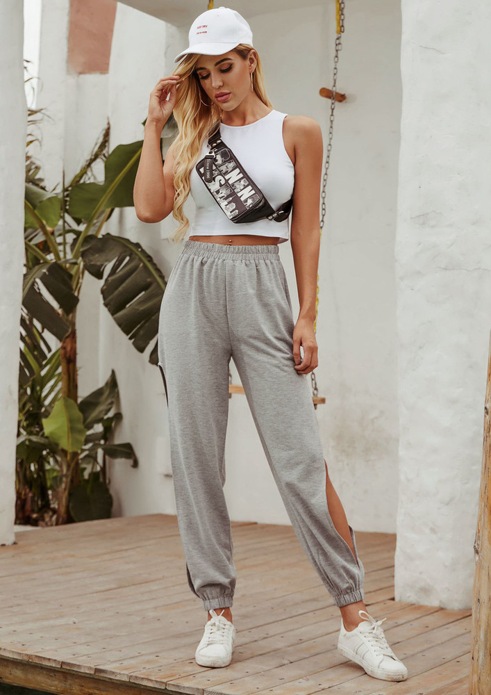 BREAKING RULES WITH SOME SASS AND CINCHED HIGH-WAIST, CUT-OUT SIDE DETAIL JOGGERS
