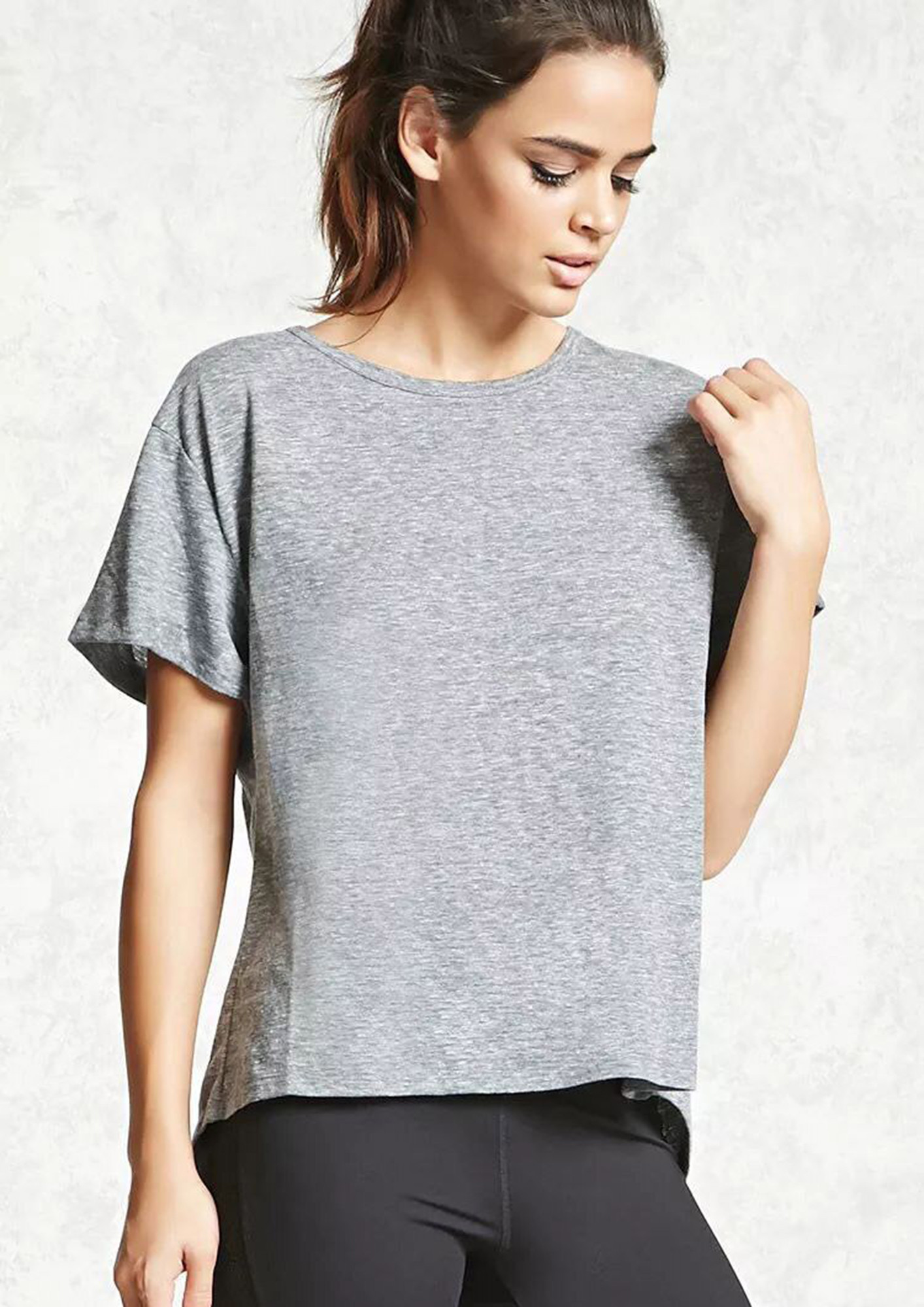 IN A CREW NECK OPEN-BACK GREY T-SHIRT TOP