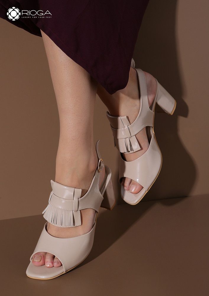Dull pink block heels with fringes